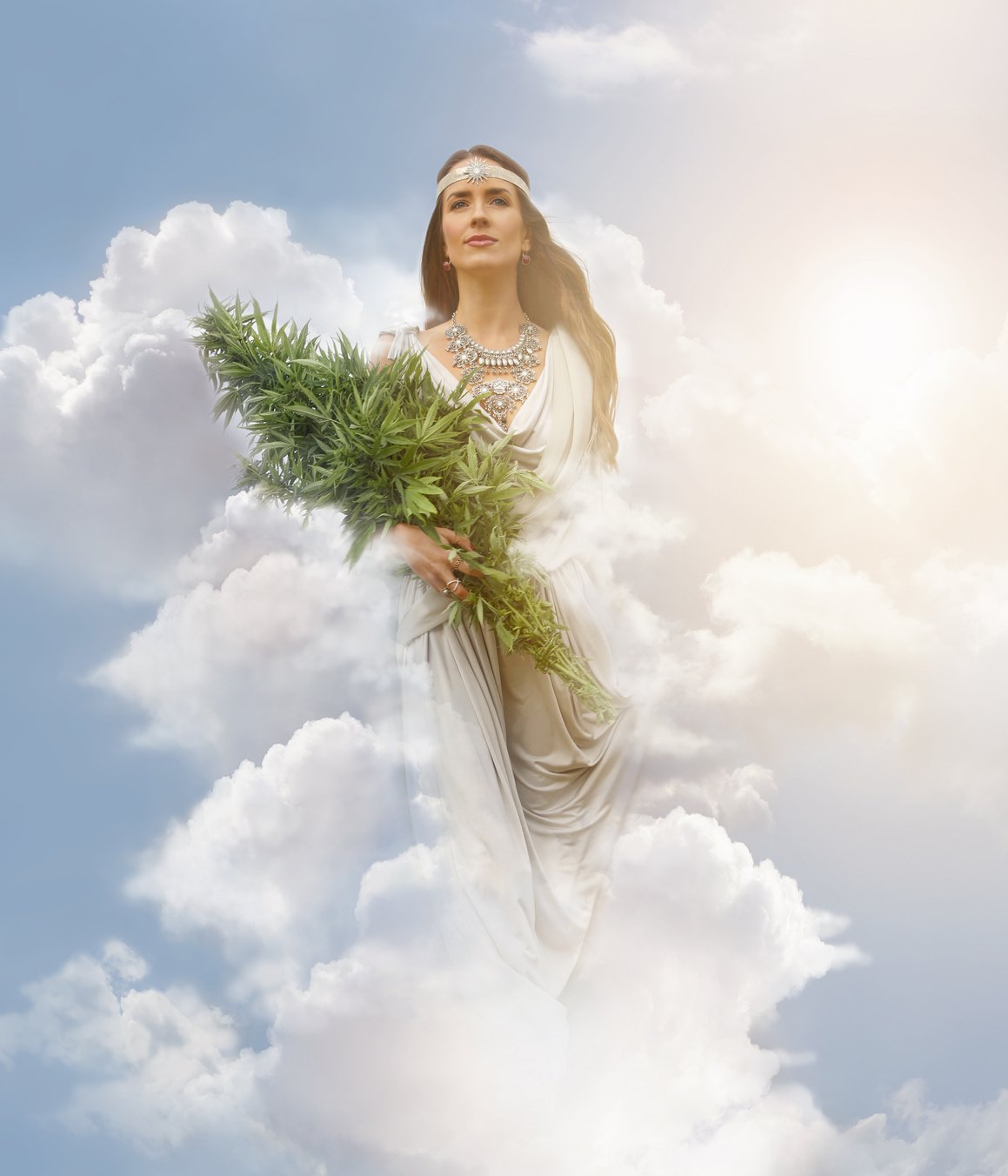 Cannabis Goddess holding bundle of cannabis plants